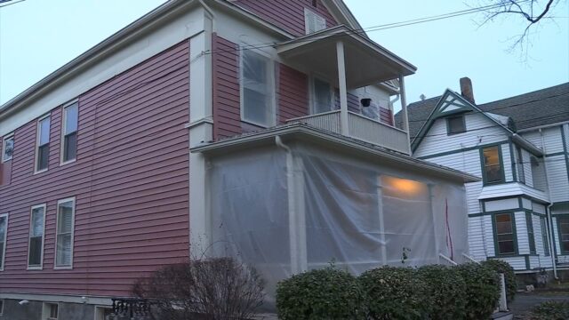 Ithaca woman wraps houses in plastic, fears asbestos from former library